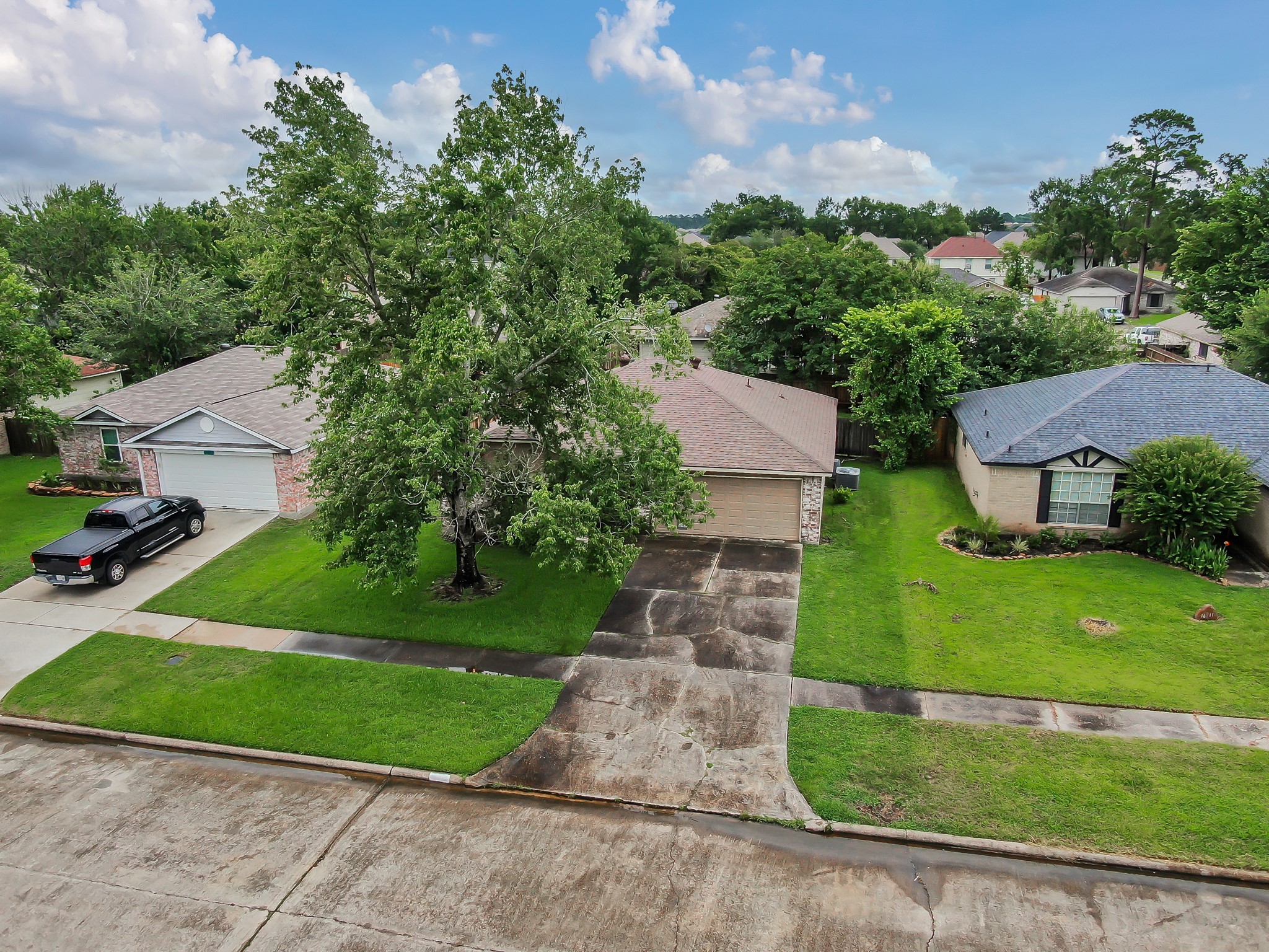16937 Larkspur Conroe, TX 77385 - Photo 41 of 45 front view of a house with a yard