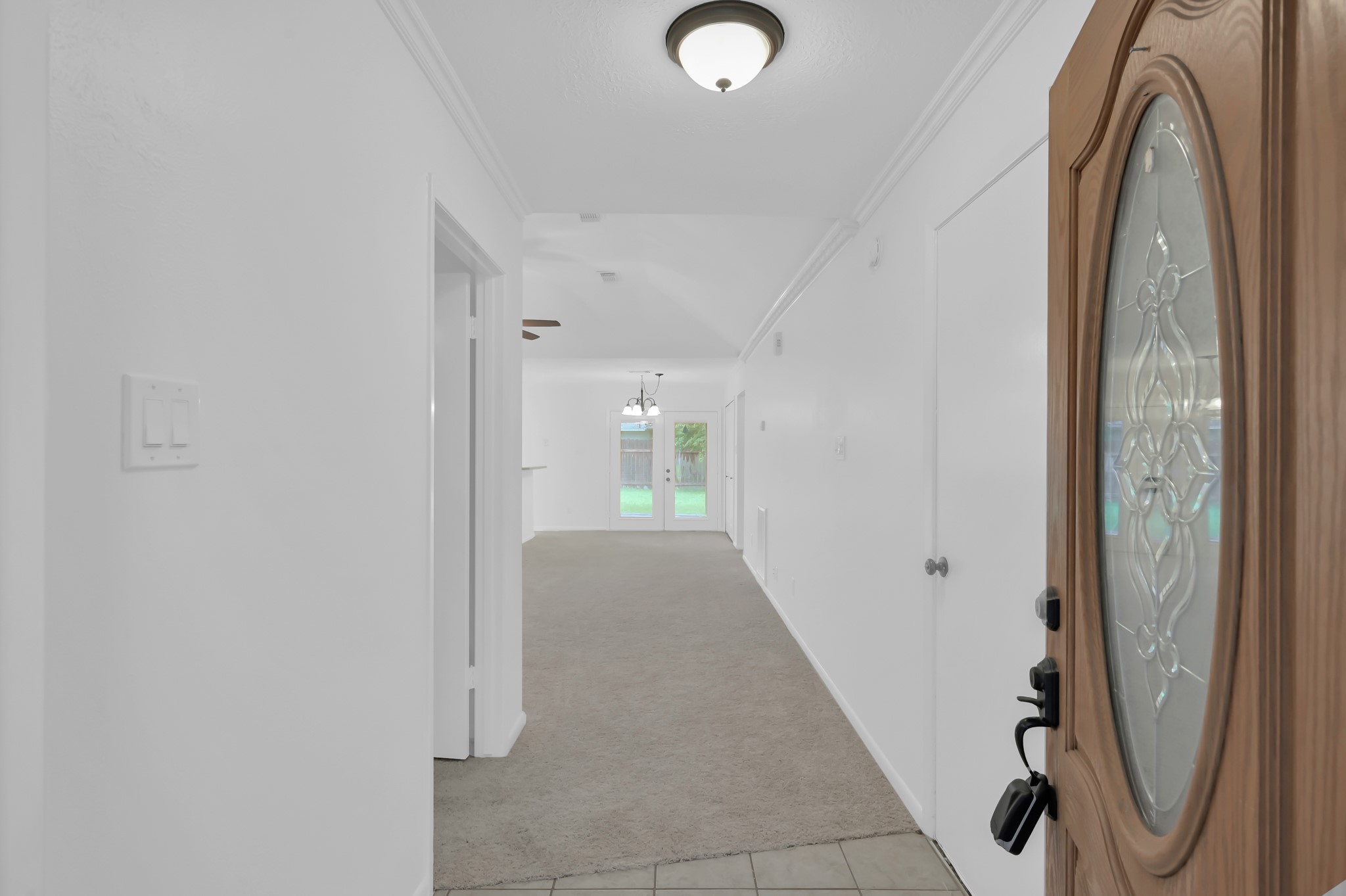 16937 Larkspur Conroe, TX 77385 - Photo 5 of 45 a view of a hallway with painted walls