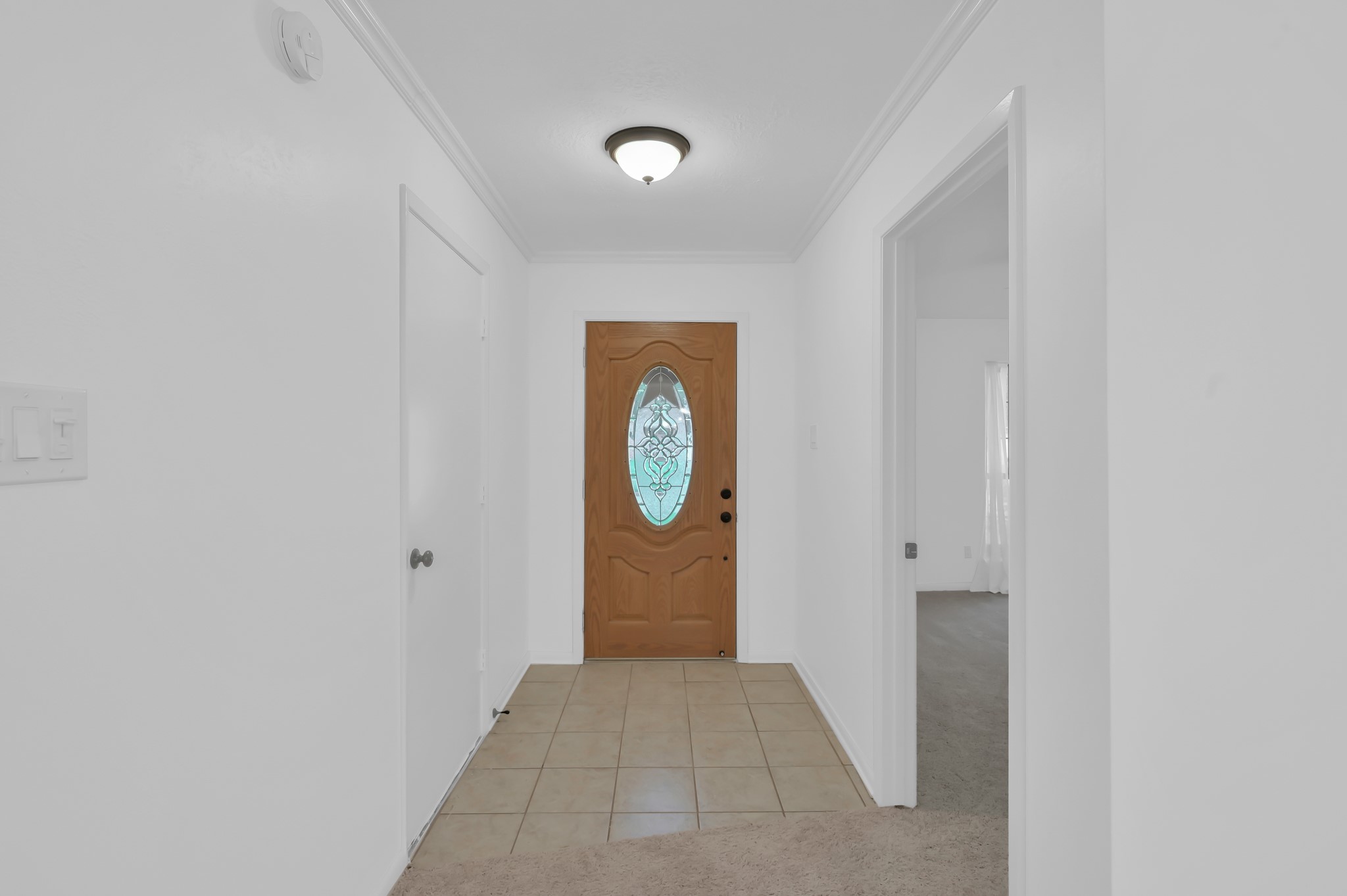 16937 Larkspur Conroe, TX 77385 - Photo 6 of 45 a view of a hallway with wooden floor