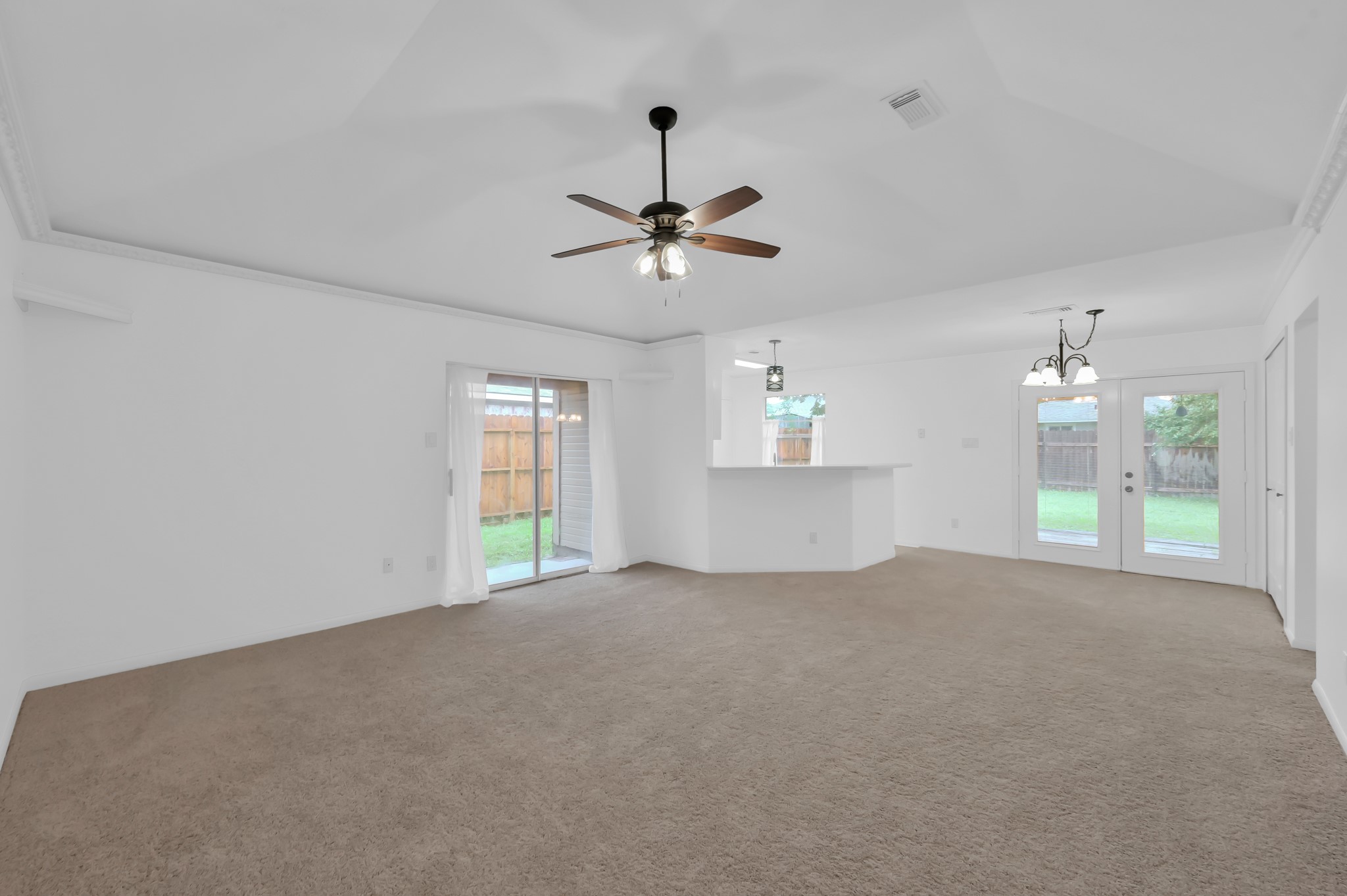 16937 Larkspur Conroe, TX 77385 - Photo 7 of 45 an empty room with windows and fan