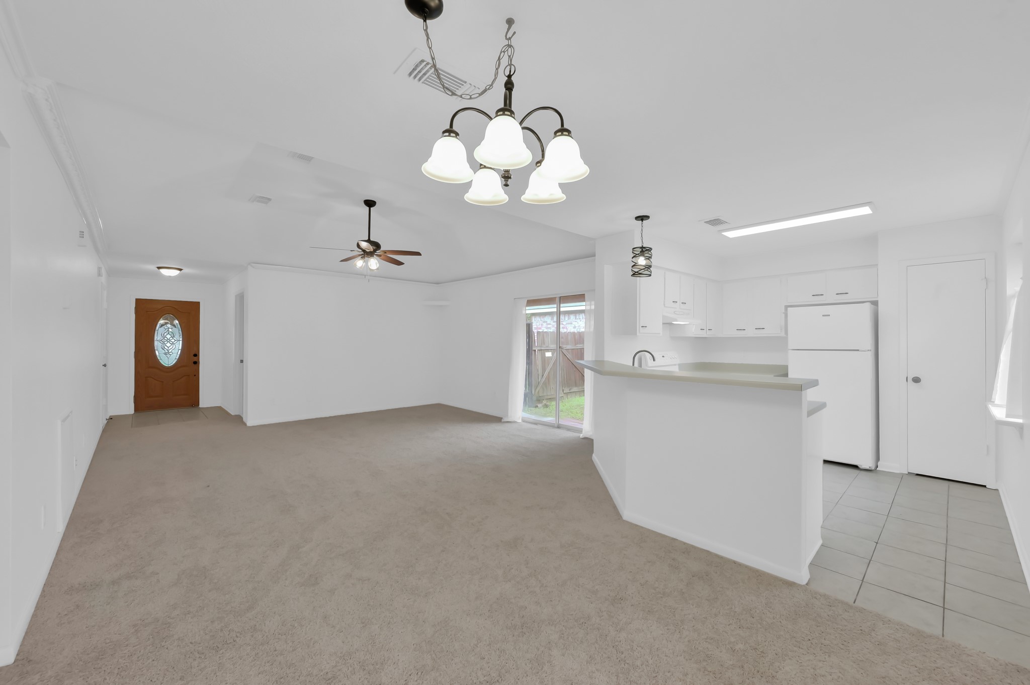 16937 Larkspur Conroe, TX 77385 - Photo 8 of 45 a view of an empty room with window and cabinet