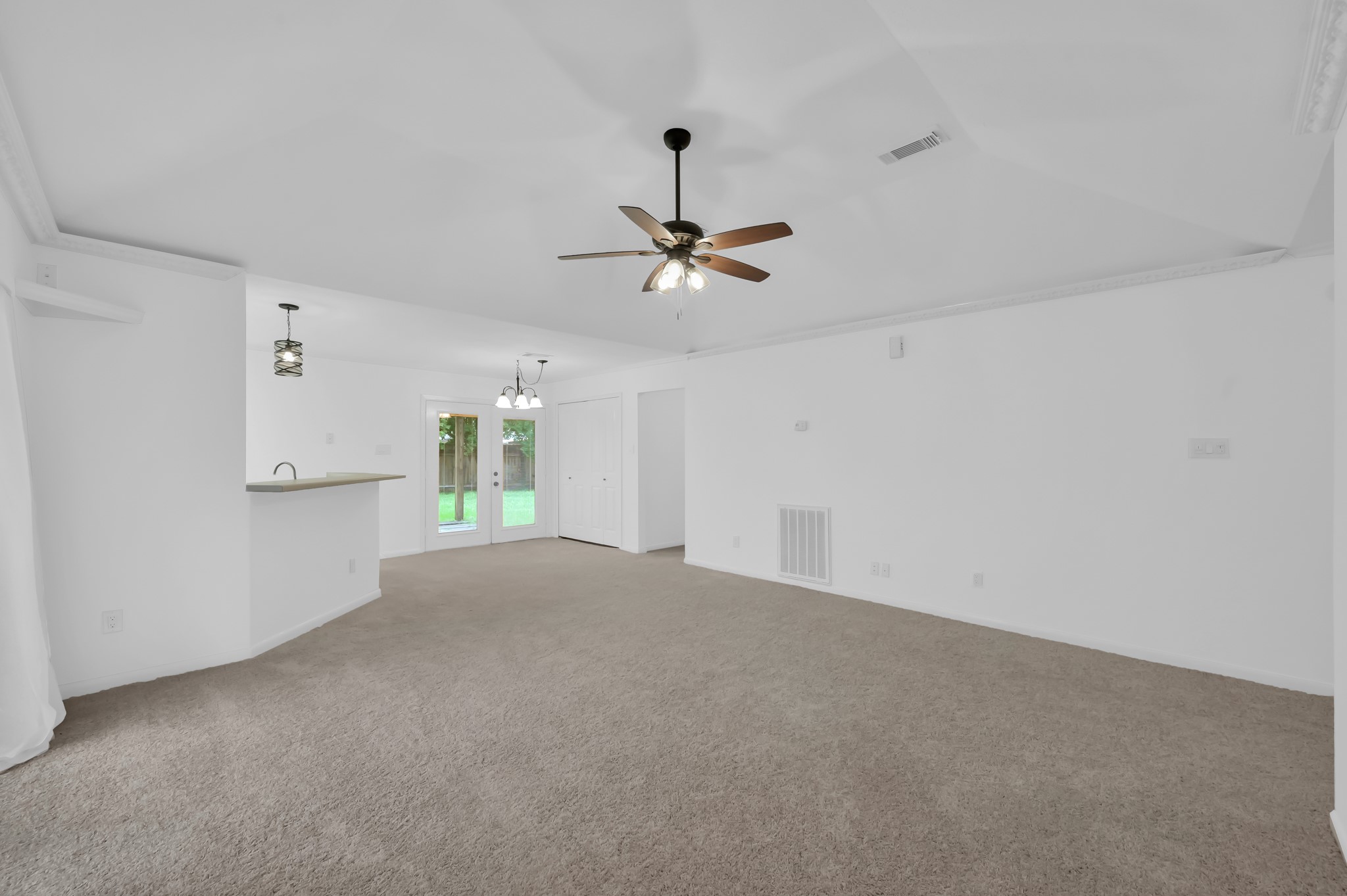 16937 Larkspur Conroe, TX 77385 - Photo 9 of 45 a view of a livingroom with a ceiling fan and window