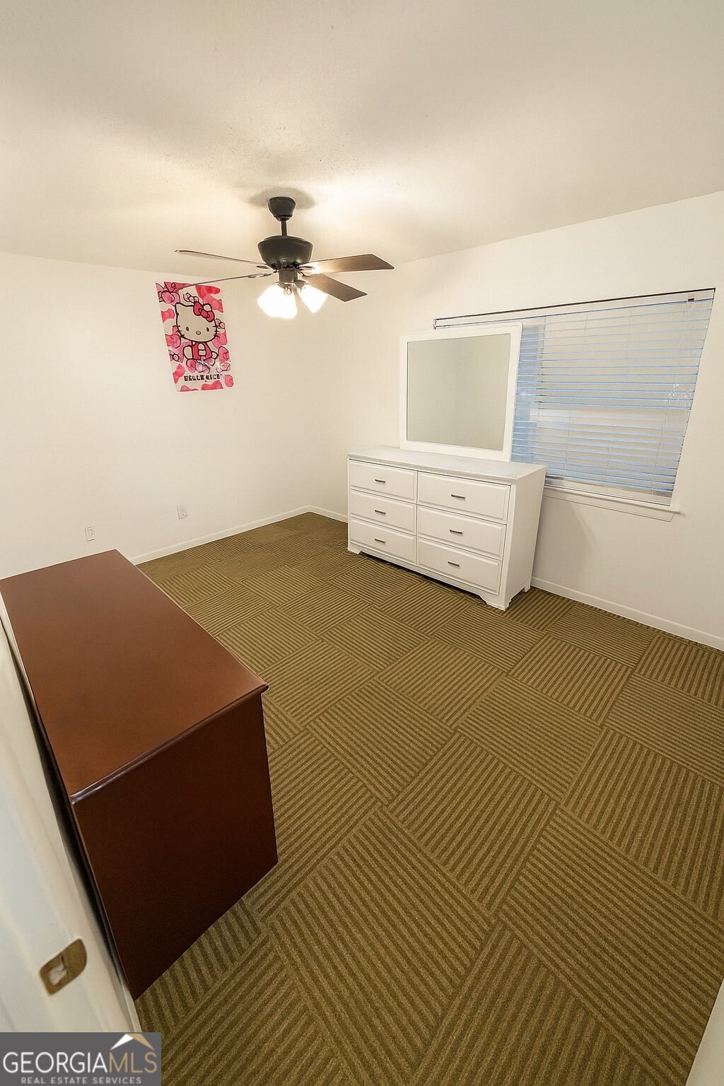 10710 Egmont Road, Unit 19 Savannah, GA 31406 - Photo 6 of 7 a view of a room with racks on the wall
