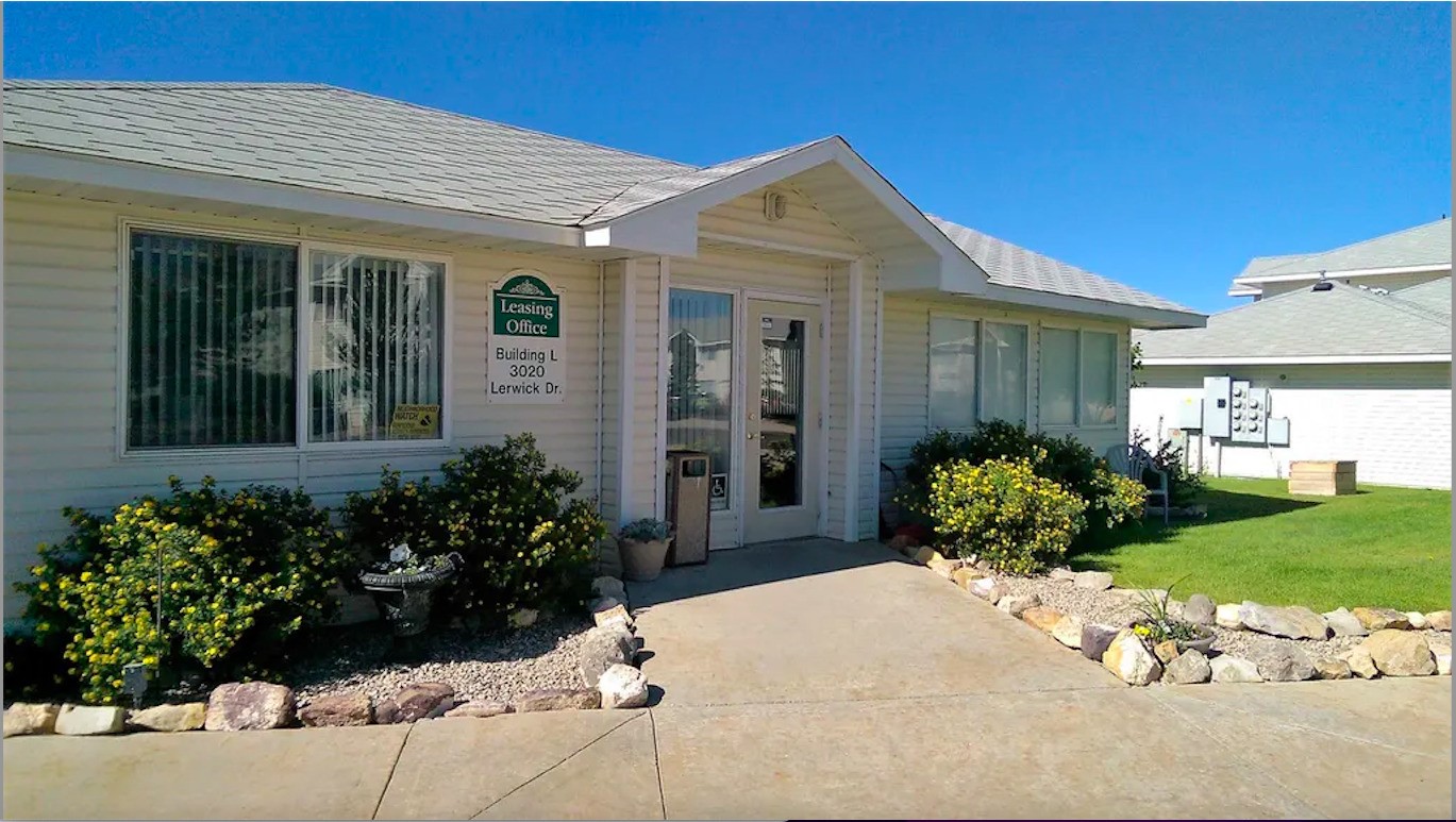 3020 Lerwick Drive Rawlins, WY 82301 - Photo 3 of 11 a front view of a house with garden