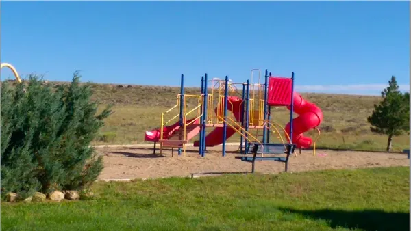 a view of park with swings