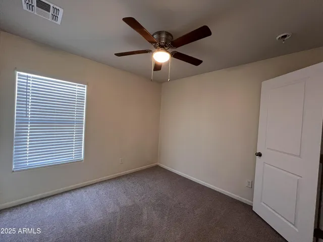 a room with water heater and a cabinet