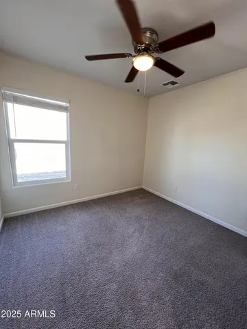 an empty room with fan