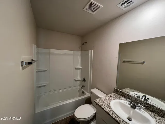 a view of a house with backyard