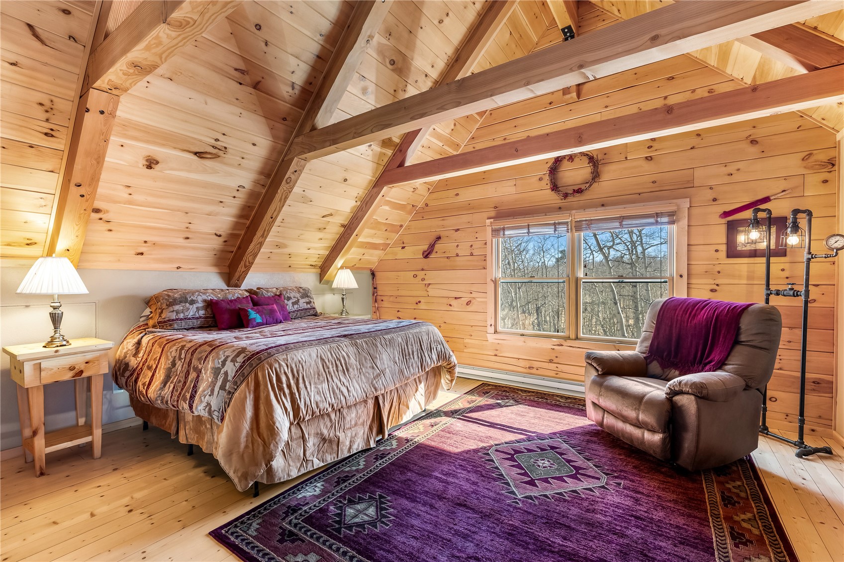 1059 Sheep Ridge Road Fairplay, CO 80440 - Photo 12 of 50 a bedroom with a bed and wooden floor