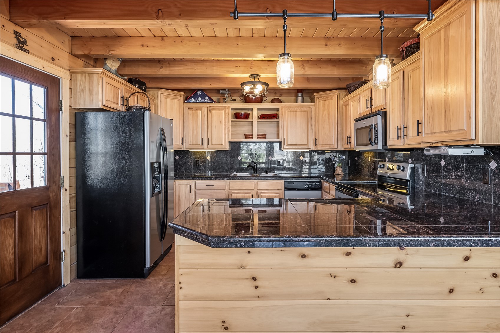 1059 Sheep Ridge Road Fairplay, CO 80440 - Photo 5 of 50 a kitchen with stainless steel appliances granite countertop a refrigerator and a stove