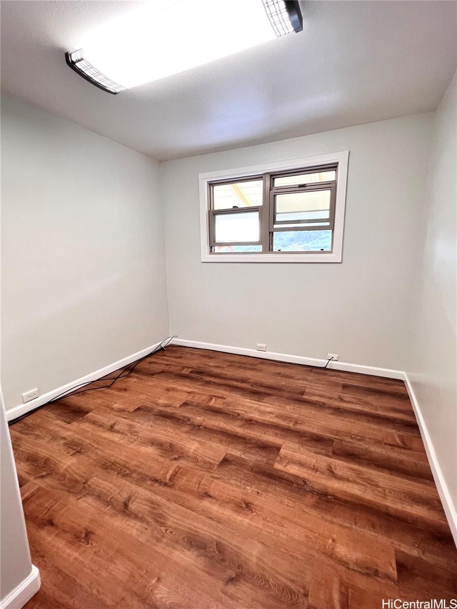 2871 Kalihi Street, Unit H Honolulu, HI 96819 - Photo 8 of 10 a view of a room with wooden floor and window
