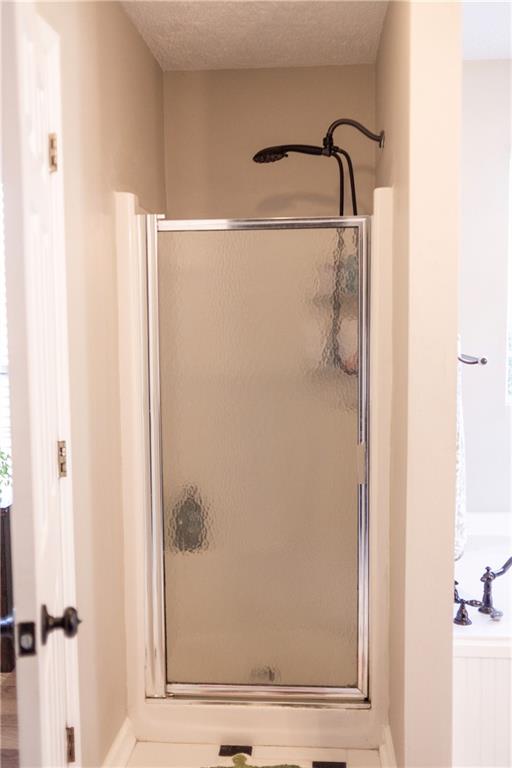 280 Mimosa Road Phenix City, AL 36870 - Photo 16 of 38 Full bath with a stall shower and a textured ceiling