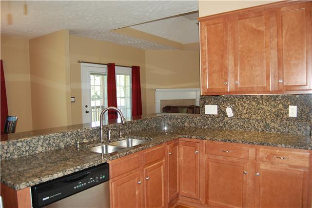 979 South Ridge Trail Clarksville, TN 37043 - Photo 3 of 20 Huge Gourmet Kitchen Open to Greatroom*Granite tops & A Wrap around Bar*Granite Back Splash* 3 Countertop Workspaces Walk In Pantry & ALL new Stainless appliances to include Bottom Freezer Refrigerator & Bread Garage*Hardwood Floors*Any Chefs Dream