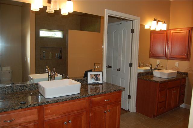 979 South Ridge Trail Clarksville, TN 37043 - Photo 4 of 20 Both Vanities are New Granite with Bowl Sinks, New Faucets, Lighting, Mirrors, Custom Tile Shower & a Linen Closet & tile Floors*This House has NO CARPET
