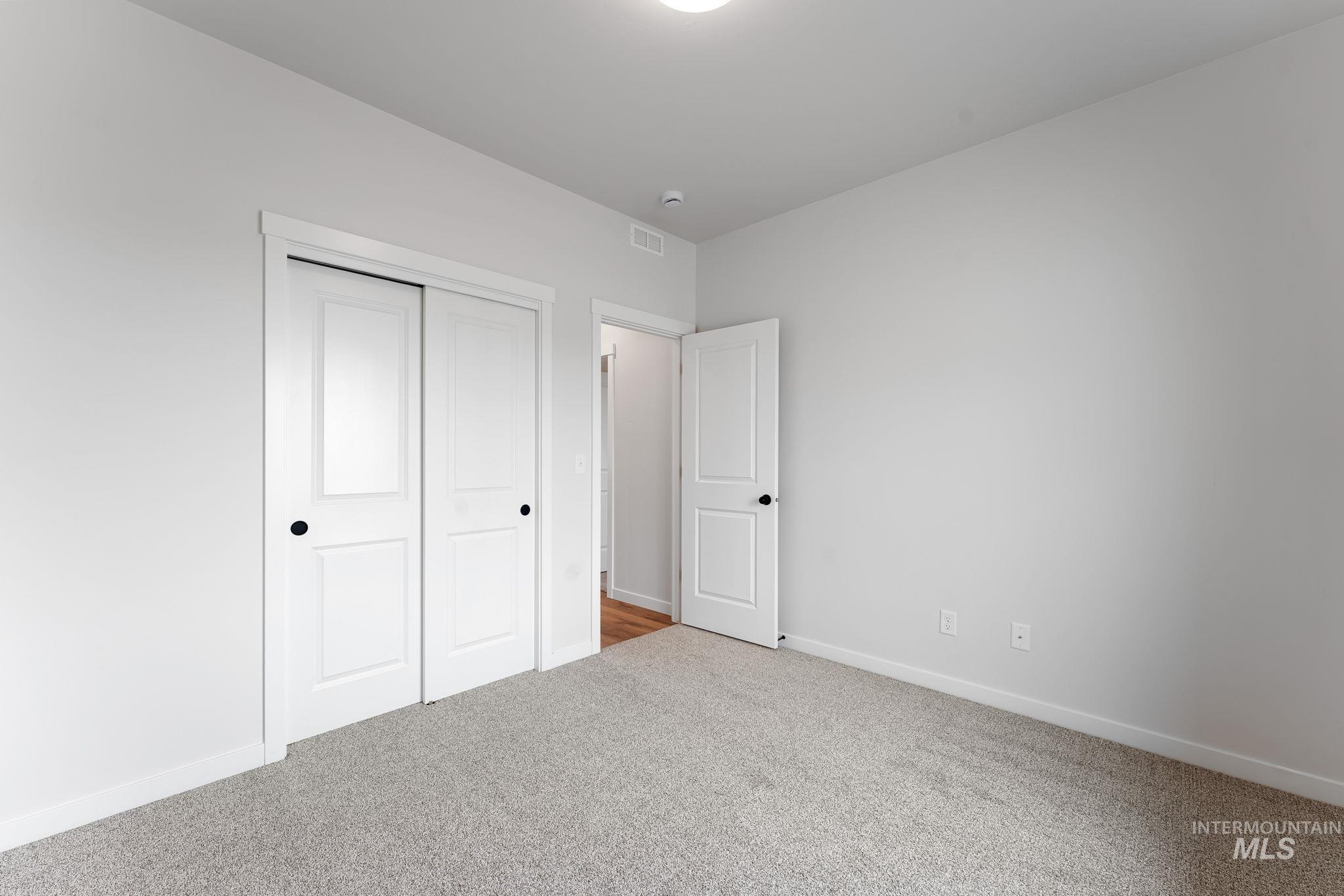 2220 Great Basin Way Burley, ID 83318 - Photo 28 of 39 Unfurnished bedroom with light colored carpet and a closet