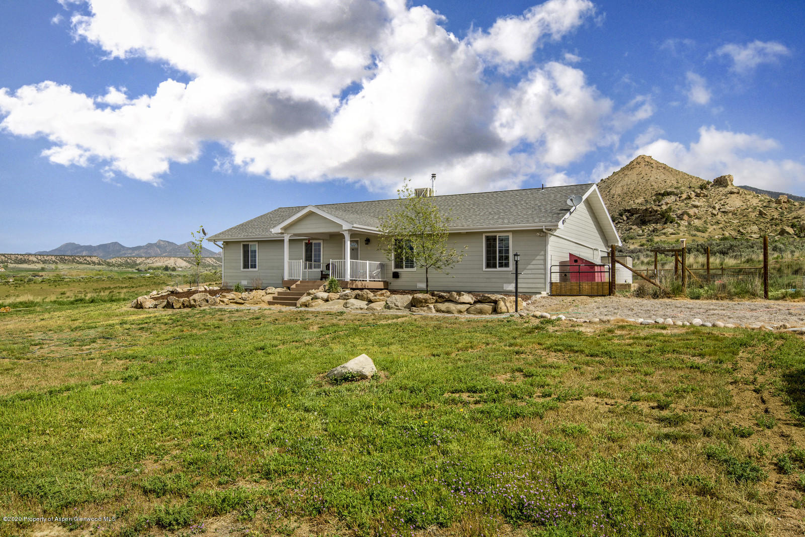 5101 County Road 233 Rifle, CO 81650 - Photo 1 of 26 a front view of house with yard and seating
