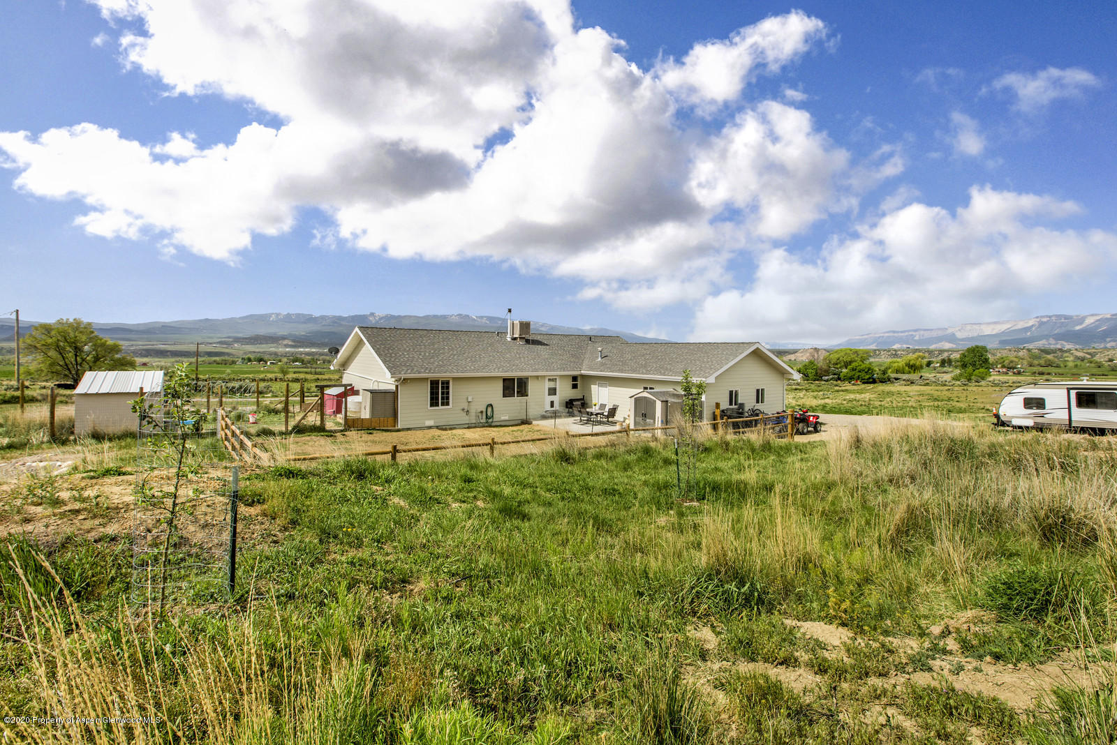 5101 County Road 233 Rifle, CO 81650 - Photo 24 of 26 a view of a big yard with plants and a large tree