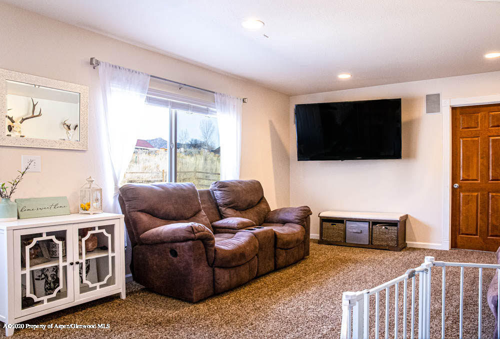 5101 County Road 233 Rifle, CO 81650 - Photo 4 of 26 a living room with furniture and a flat screen tv
