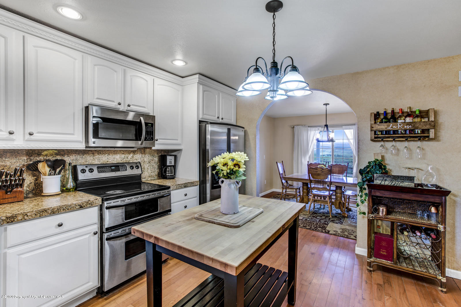 5101 County Road 233 Rifle, CO 81650 - Photo 9 of 26 a kitchen with stainless steel appliances granite countertop a stove refrigerator and microwave
