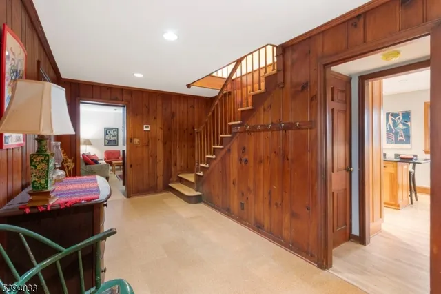 a view of an entryway with wooden floor and furniture