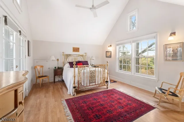 a bathroom with a granite countertop sink and large window