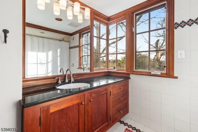 a bedroom with a bed couch and window