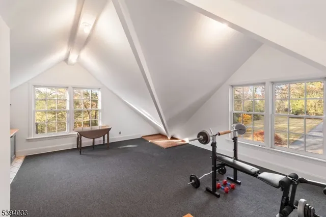 a bathroom with a toilet a sink and a mirror