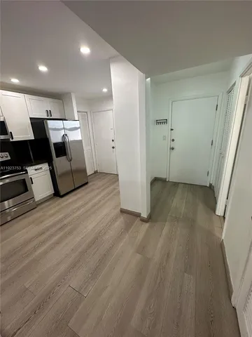 a view of a livingroom with wooden floor