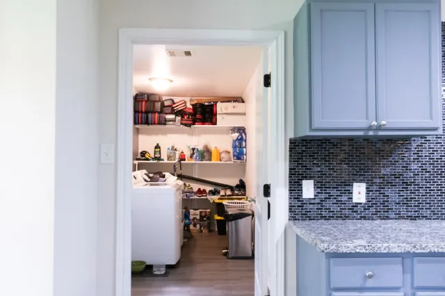 a kitchen with stainless steel appliances granite countertop a refrigerator and a stove