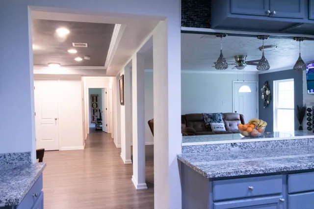 a kitchen with stainless steel appliances granite countertop a sink and cabinets
