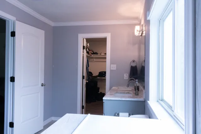 a bathroom with a double vanity sink and a mirror