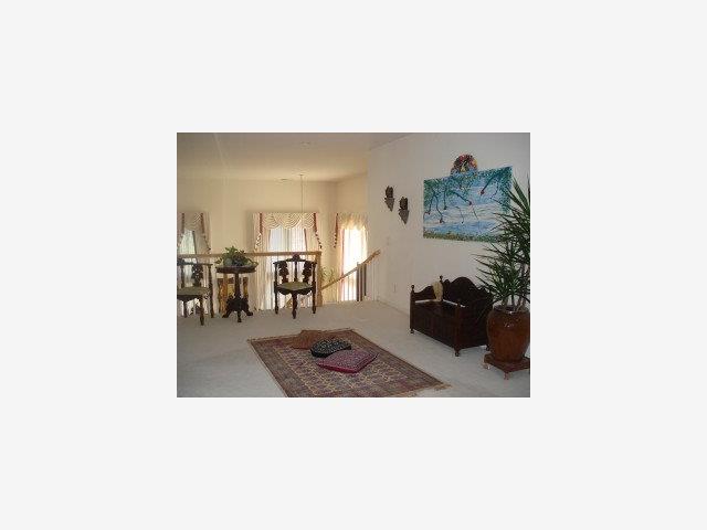 2210 Wynfair Ridge Way San Jose, CA 95138 - Photo 5 of 9 a picture of a living room with a table and chairs