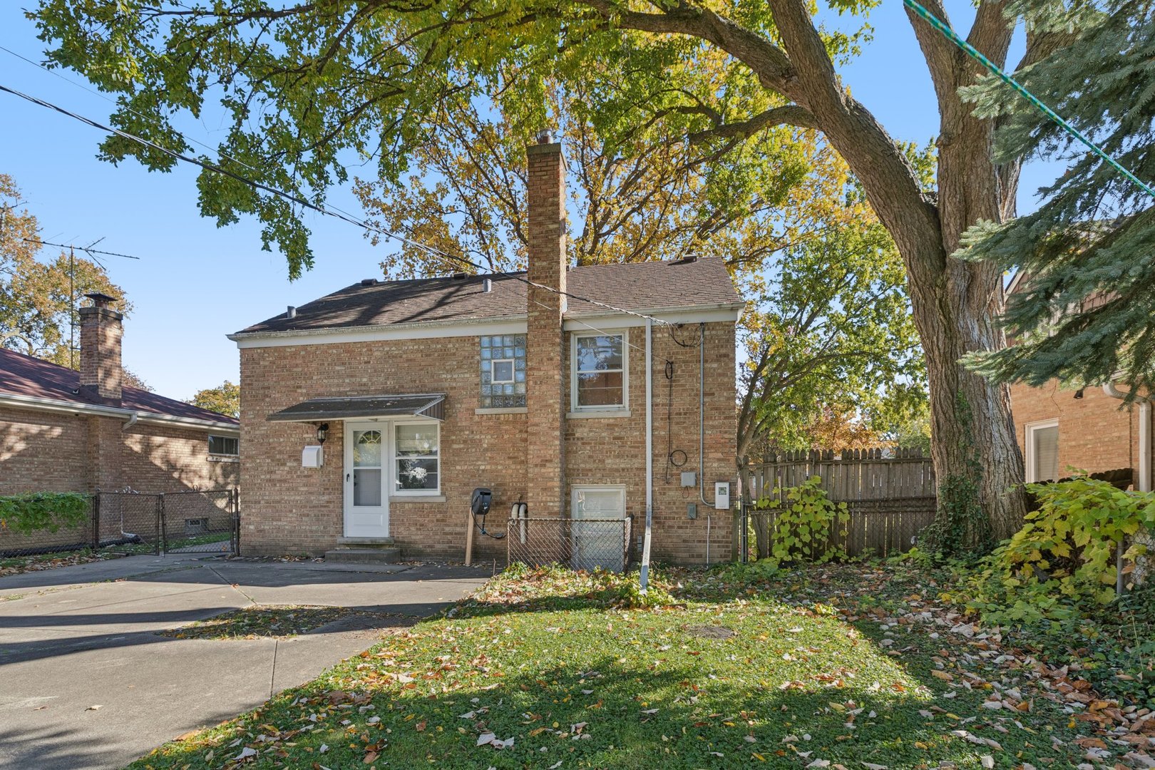 8846 Austin Avenue Morton Grove, IL 60053 - Photo 30 of 35 front view of a house with a tree in a yard