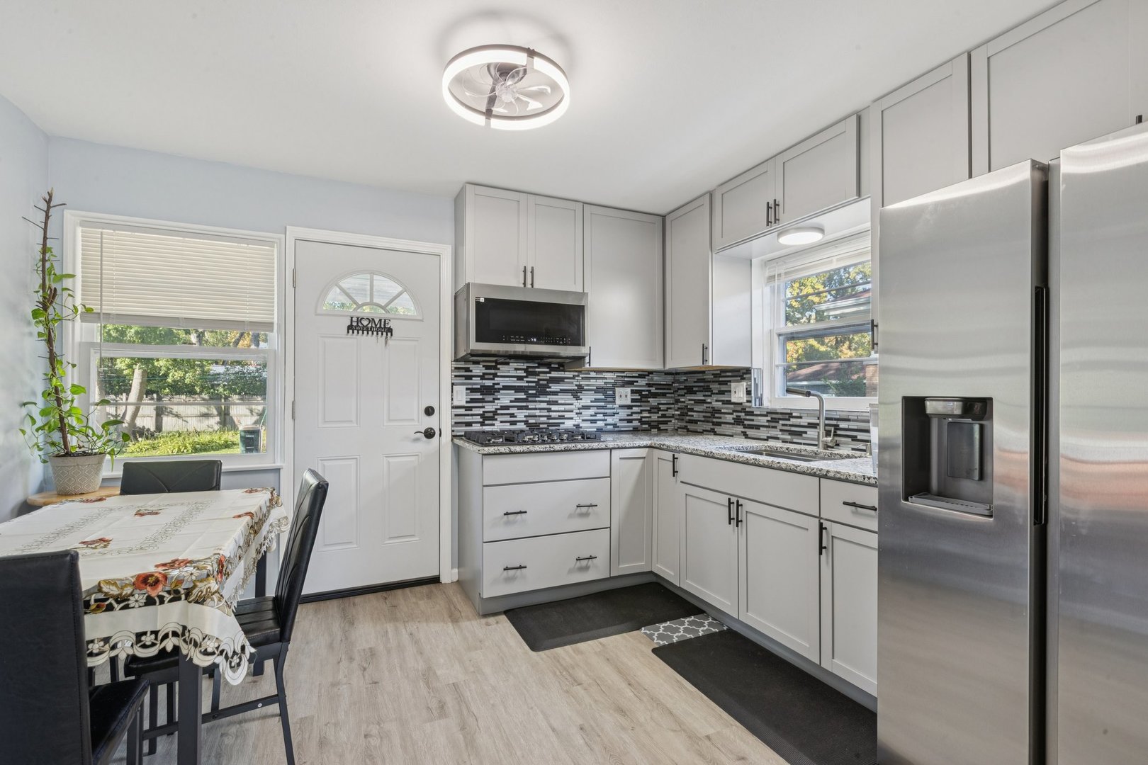 8846 Austin Avenue Morton Grove, IL 60053 - Photo 7 of 35 a kitchen with stainless steel appliances a refrigerator sink and microwave