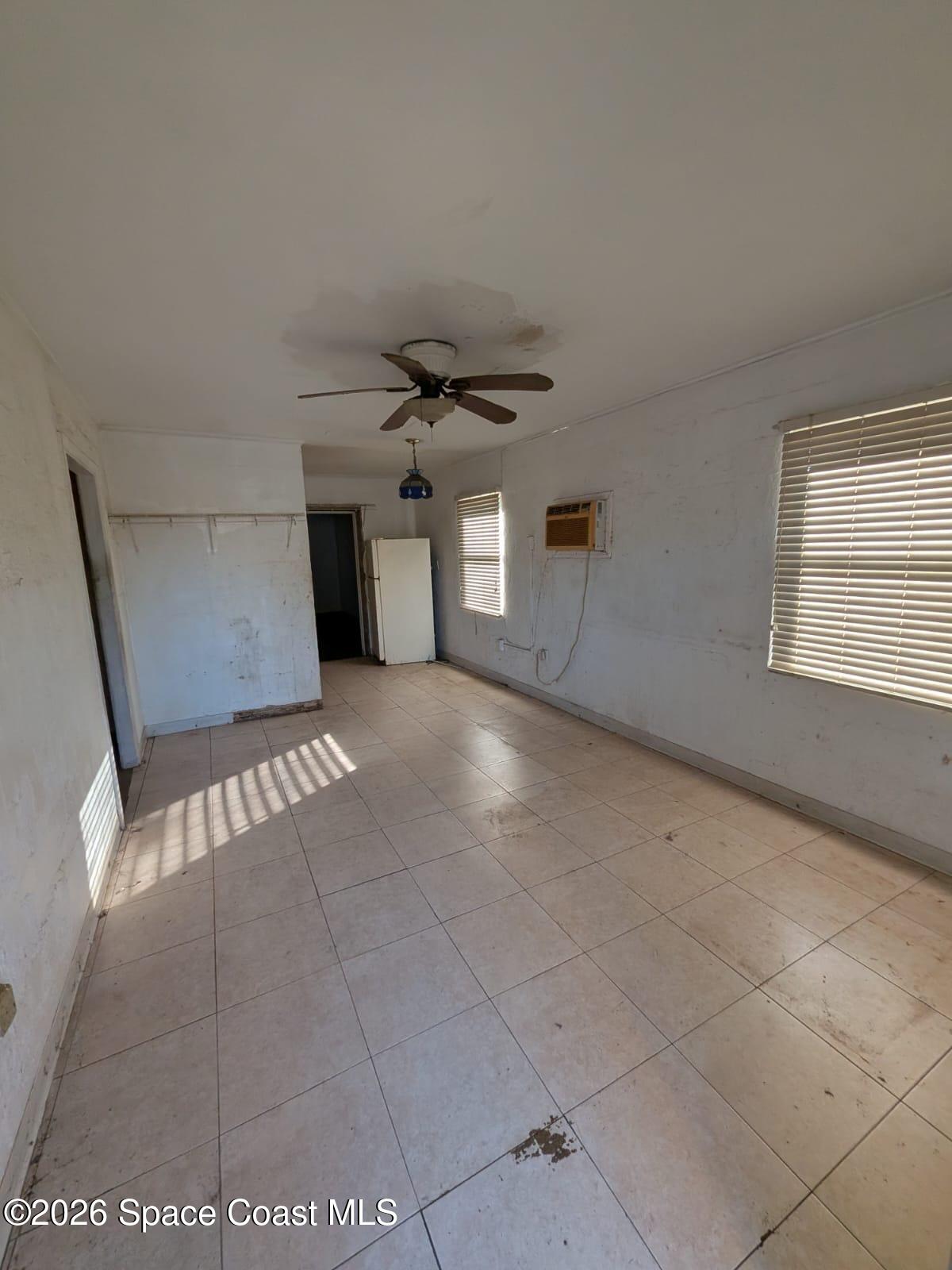 545 Easy Street Merritt Island, FL 32953 - Photo 3 of 9 a view of a livingroom with a staircase