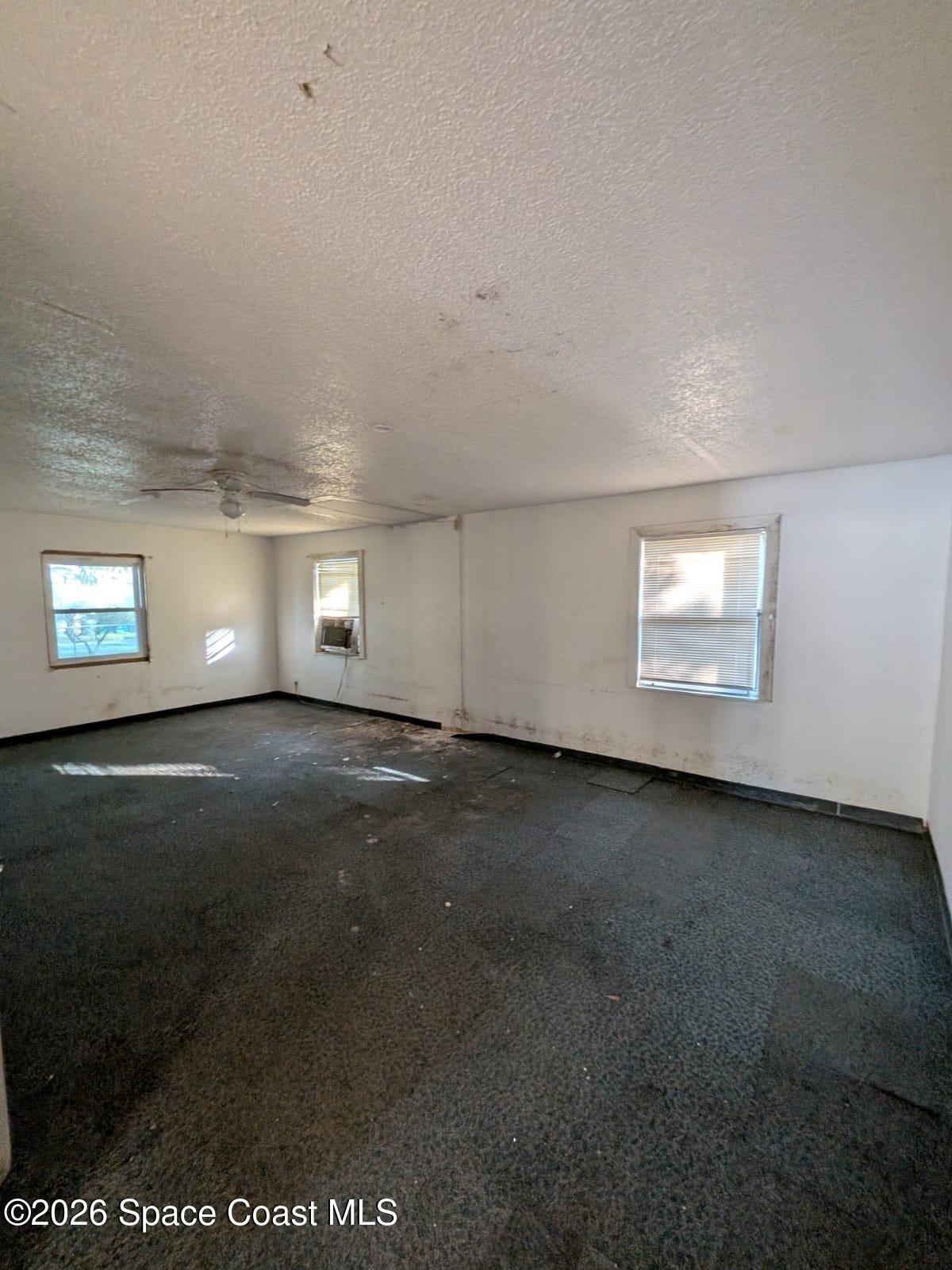 545 Easy Street Merritt Island, FL 32953 - Photo 8 of 9 a view of empty room with window