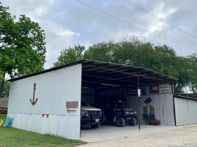 a view of house with backyard