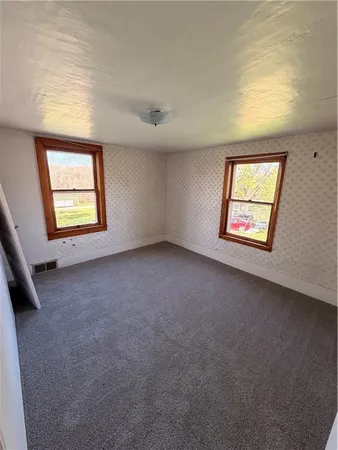 an empty room with windows
