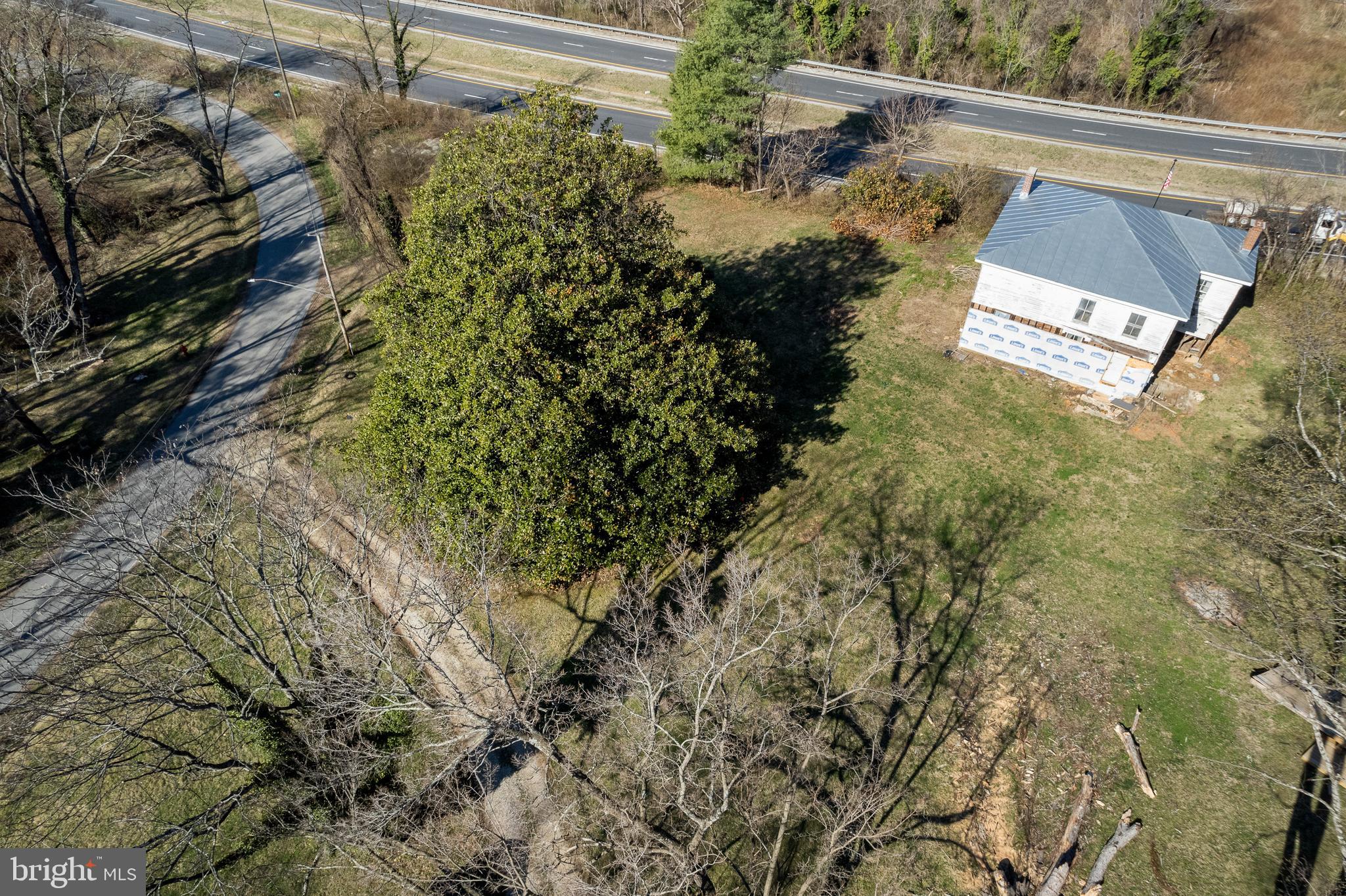 Drone View Of Gravel Driveway & House