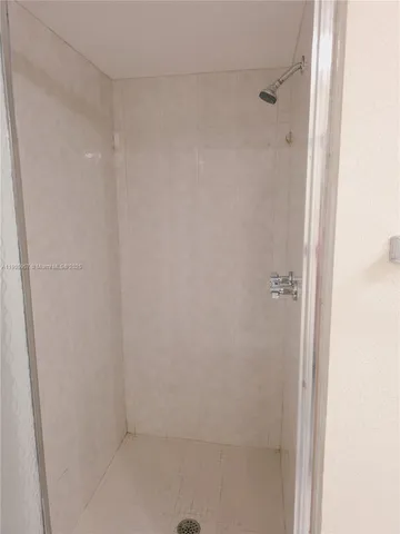 a view of hallway with a mirror