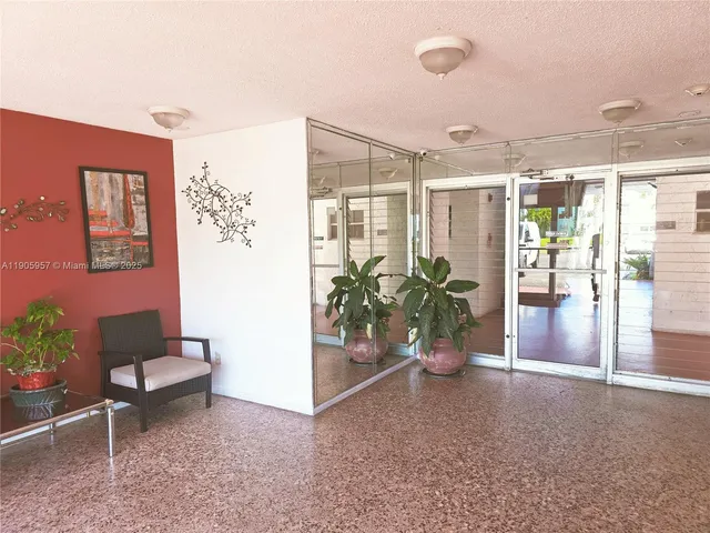 a view of a room with a hallway