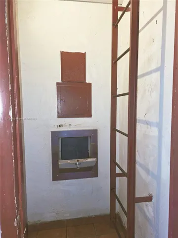 a view of a street with a car parked in the background