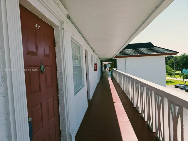 a view of a small yard from a balcony