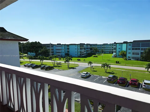 a view of a park with large trees
