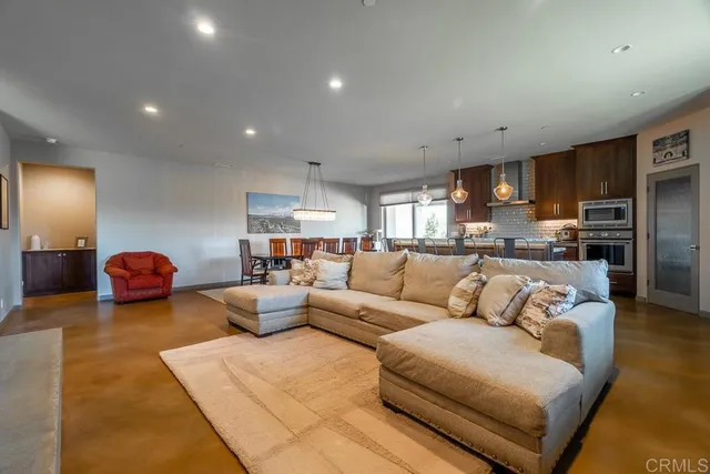 a kitchen with lots of counter space and stainless steel appliances