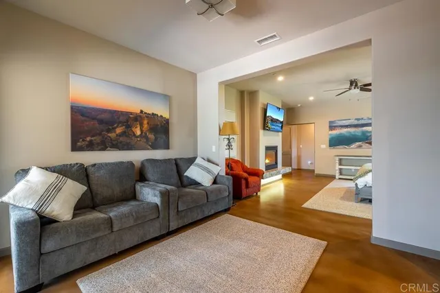 a spacious bedroom with a bed and a fireplace