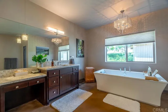 a bathroom with a double vanity sink and a mirror