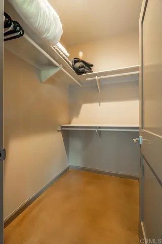 a bedroom with bed and a window