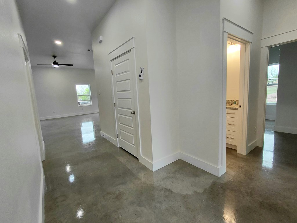 508 West Rainey Street Mason, TX 76856 - Photo 3 of 25 wooden floor in an empty room with a window