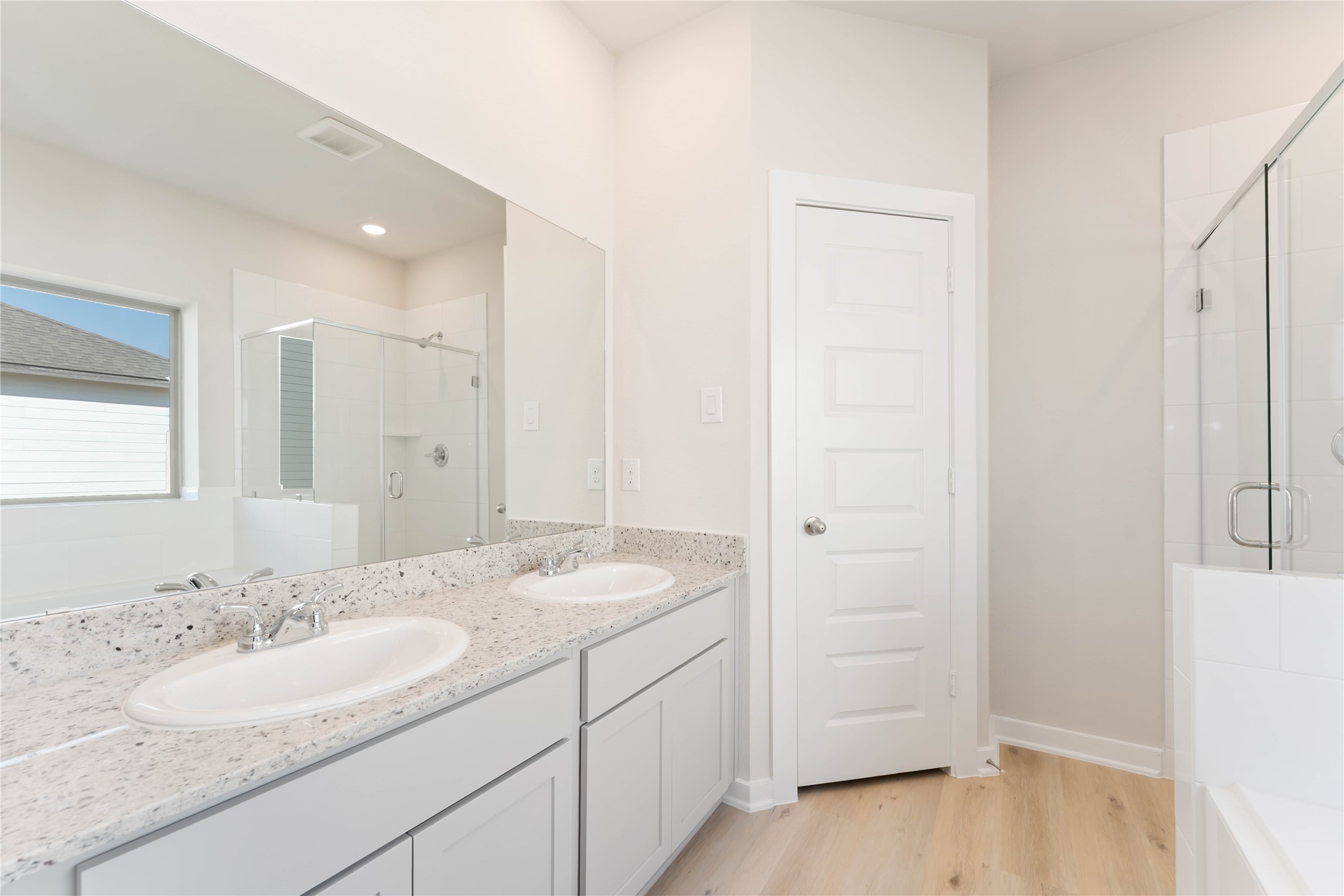 25992 Liberation Road Cleveland, TX 77328 - Photo 14 of 27 a bathroom with a granite countertop sink and a mirror
